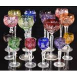Sixteen flash overlaid cut glass hock glasses in various colours and designs, largest 21cm tall.