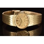 Omega 9ct gold ladies wristwatch ref. 8329 with black hands, two-tone baton hour markers, gold