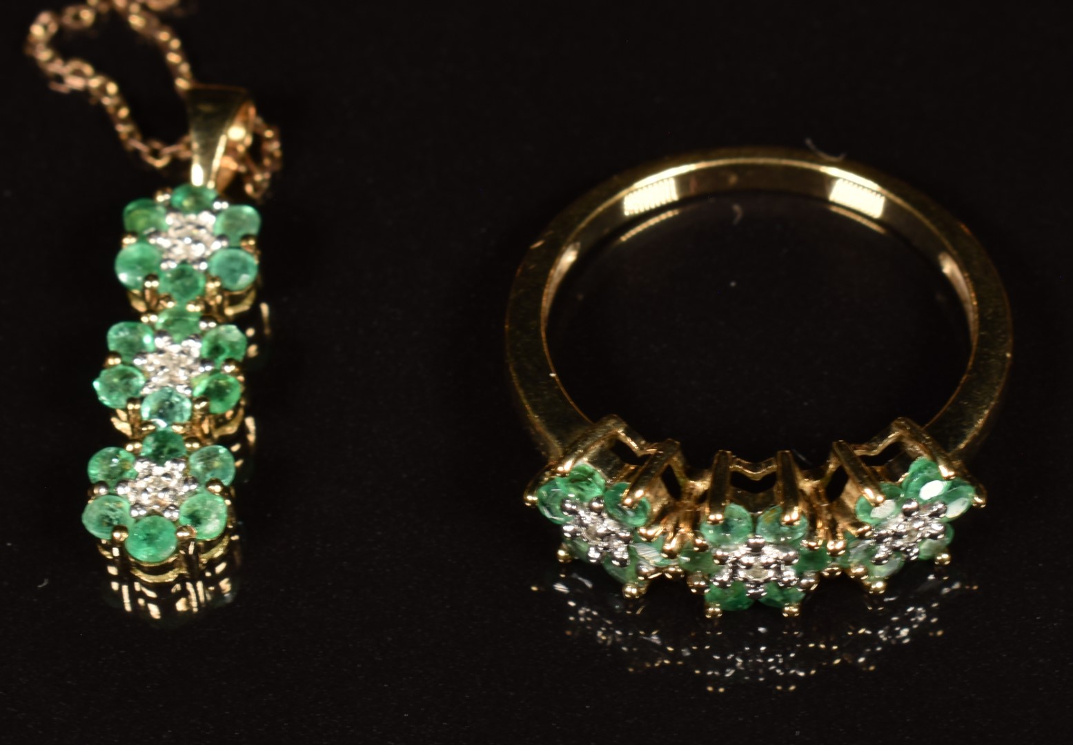 A 9ct gold ring set with diamonds and emeralds in three floral clusters, with matching pendant and - Image 2 of 3