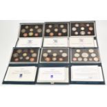 Six Royal Mint proof coin sets comprising 1983, 1985, 1986, 1990, 1992 and 1997