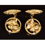 A pair of c1920 18ct gold cufflinks in the form of hounds, each set with a diamond, 10g, in fitted