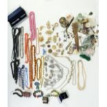 A collection of costume jewellery including silver earrings, agate beads, vintage brooches, enamel