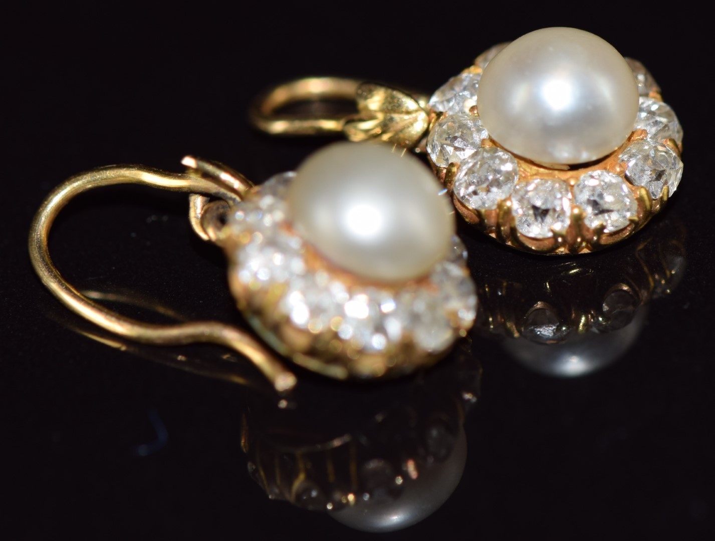 A pair of c1900 18ct gold earrings, each set with a natural pearl measuring 6.4mm surrounded by - Image 2 of 5