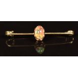A 9ct gold brooch set with an opal cabochon, 1.8g