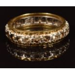 A 9ct gold eternity ring set with spinel, 3.8g