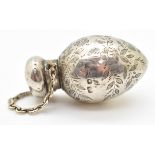 Victorian hallmarked silver scent bottle of egg shape, with engraved decoration of flowers and