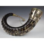 A large curved horn drinking vessel, the silver plated and gilt mounts set with agate cabochons