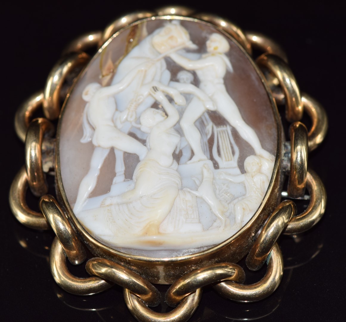 Victorian pinchbeck brooch set with a cameo depicting classical scene with a bull, 29.6g, 7.4 x 6.