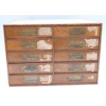 Oak haberdashery jewellery shop cabinet of ten drawers with campaign style handles, some with