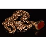 A 9ct rose gold double Albert / watch chain and a 9ct gold fob set with carnelian agate, c1900,