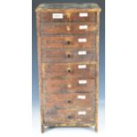 19th/20thC miniature pine haberdashery chest of eight compartmentalised graduated drawers containing