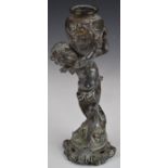 Spelter model of a cherub holding a vase aloft, height 24cm