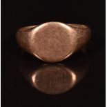 A 9ct rose gold signet ring, 4.7g (band has split)