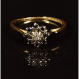 An 18ct gold ring set with a diamond and sapphires (shoulder has broken), 2g