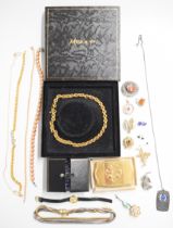 A collection of jewellery including enamel brooch, Monet necklace in box, pearl necklace, silver