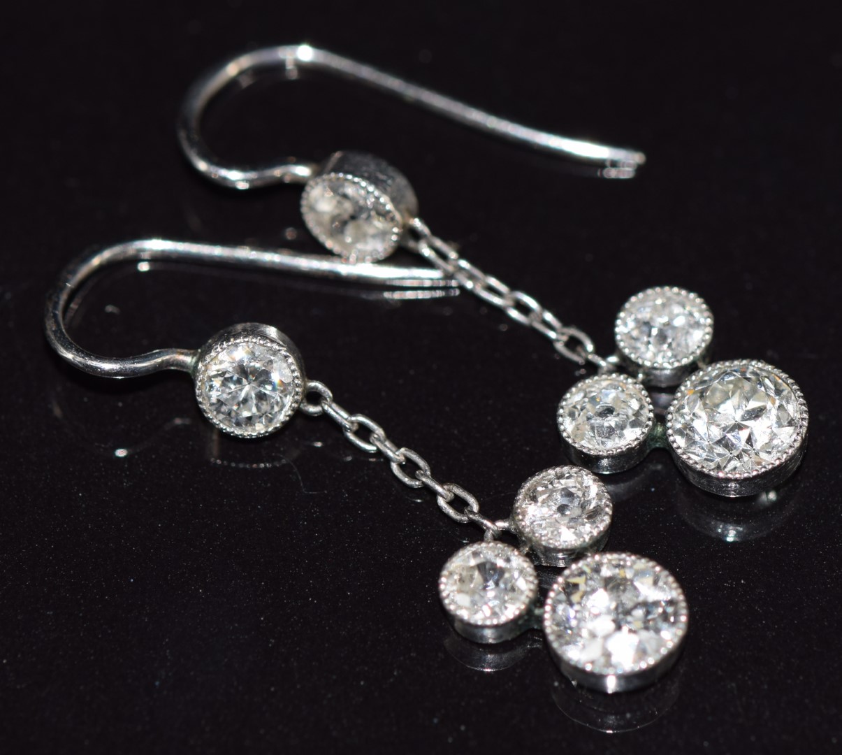 A pair of Art Deco platinum earrings, each set with transitional cut diamonds of approximately 0. - Image 3 of 3
