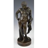 Bronze study of a male nude in the classical style with robe draped over his shoulder and arm, on