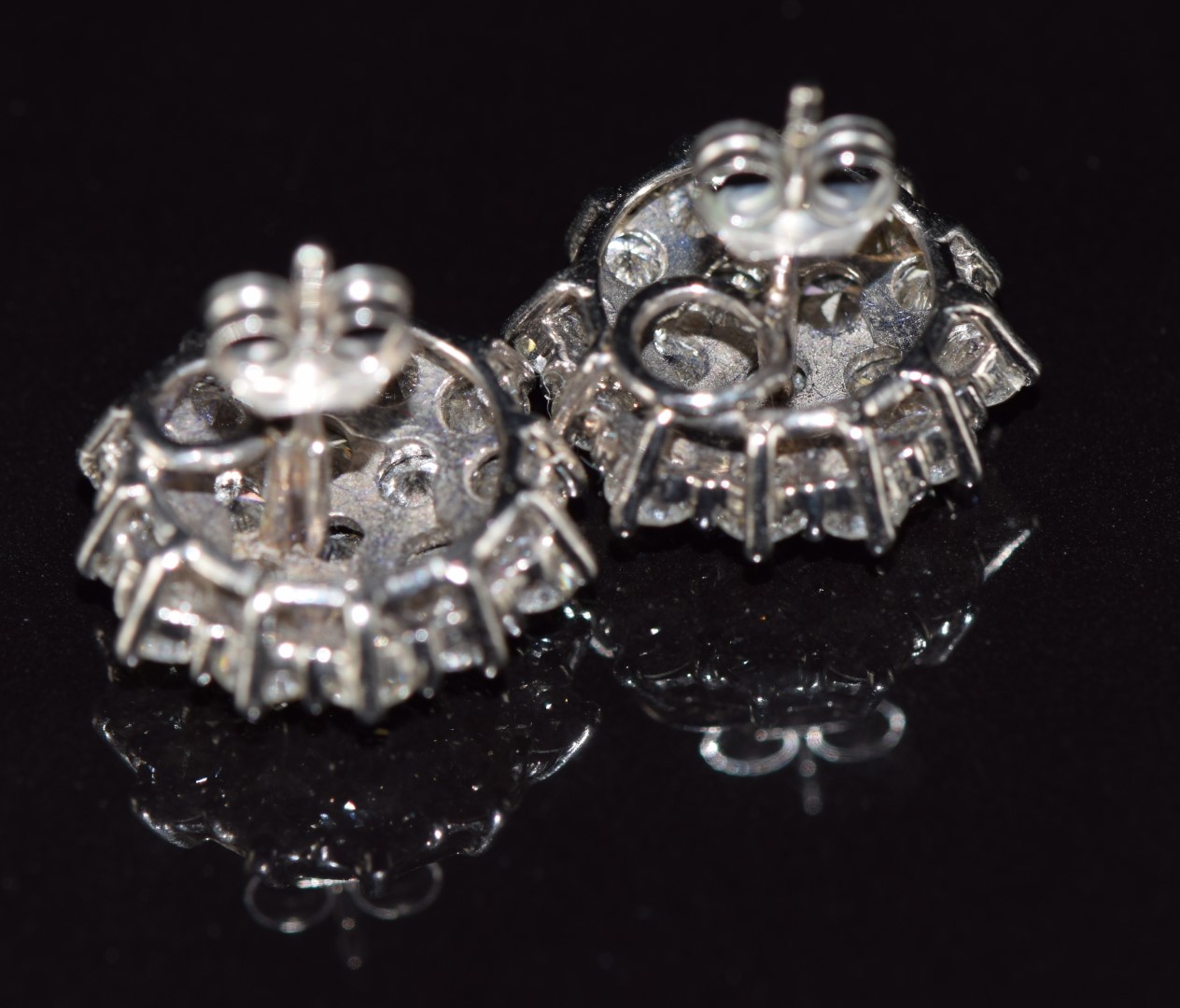 A pair of 18ct white gold earrings each set with nineteen round cut diamonds, each approximately 0. - Image 3 of 3