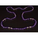 A beaded amethyst necklace set with 9ct gold beads