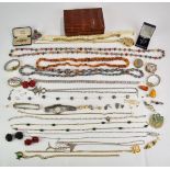 A collection of jewellery including silver fish pendant, Trifari necklace, Kenneth Lane brooch,