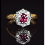 A c1920 18ct gold ring set with a ruby and diamonds, 1.6g, size F