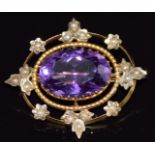 Edwardian 9ct gold brooch set with an oval cut amethyst and seed pearls, 6.0g, 3.1 x 2.8cm