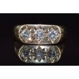 A 9ct gold ring set with three diamonds, measuring 0.4ct, 0.3ct & 0.3ct in star settings, 5.5g, size