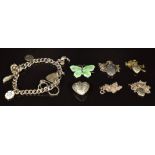 Four silver pendants, three silver chains, silver charm bracelet and a silver butterfly brooch set