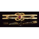 A c1915 15ct gold brooch set with a ruby, 4.1g, 4.5cm