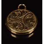 A 9ct gold locket with scrolling decoration, 7.7g