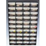 A collection of world coinage in a plastic collector's 40 drawer cabinet, includes Euros