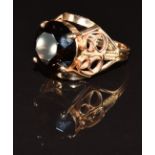 A 14k gold ring set with a round cut smoky quartz, 8.0g, size R