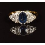 Art Deco 18ct gold ring set with an oval cut sapphire of approximately 0.7ct and diamonds in a