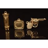 Three 9ct gold charms in the form of a postbox, gun and television, 3g