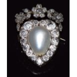A mid to late Victorian brooch in the form of a heart set with a large natural pearl measuring 11.