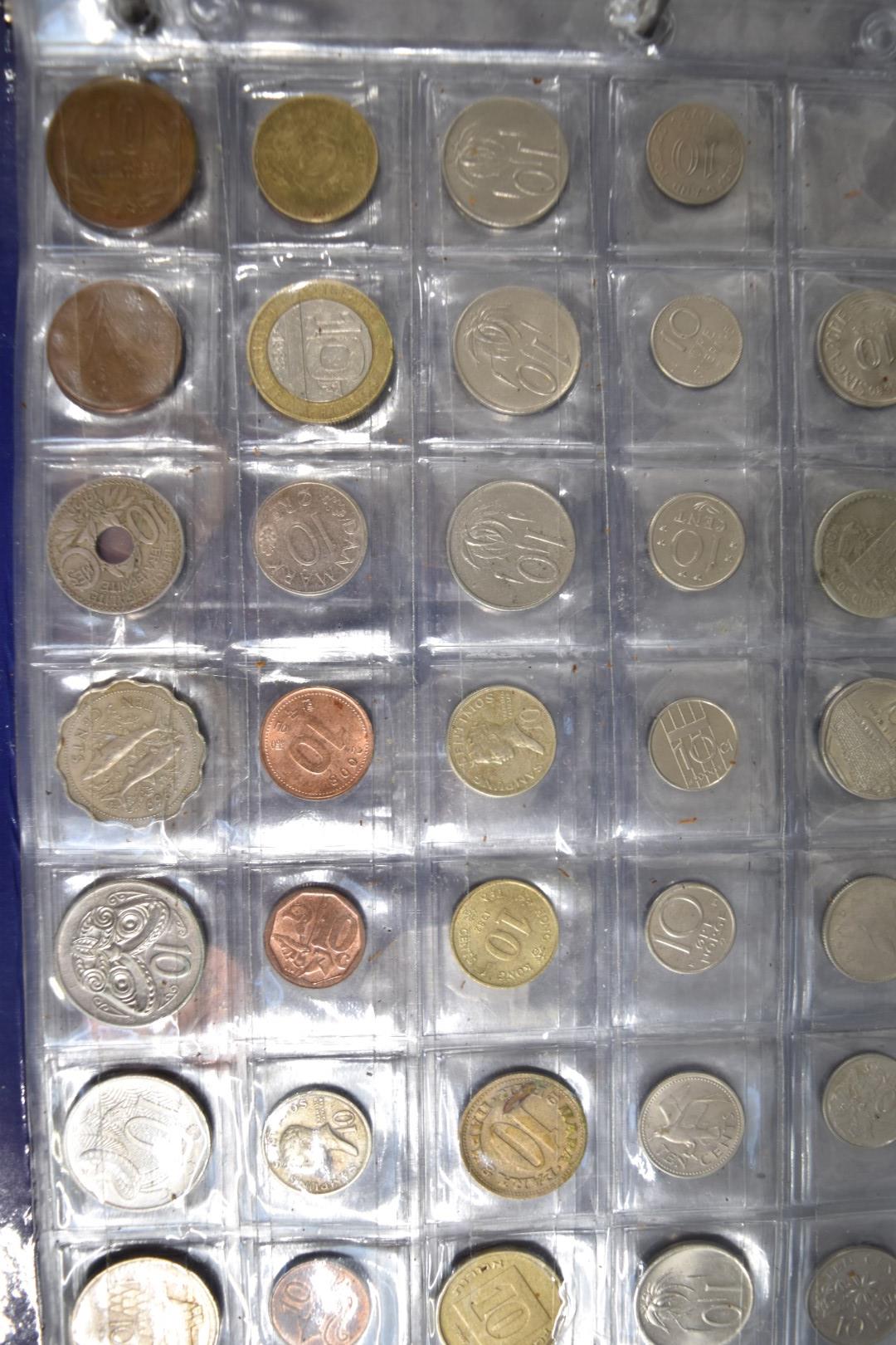 A collection of world coins contained in a Change Checker album - Bild 4 aus 6