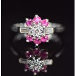 An 18ct white gold ring set with round cut rubies and baguette and round cut diamonds, 4.3g, size N
