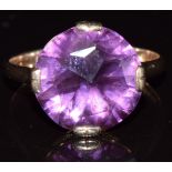 A 9ct gold ring set with a synthetic purple sapphire, 4.7g , size T