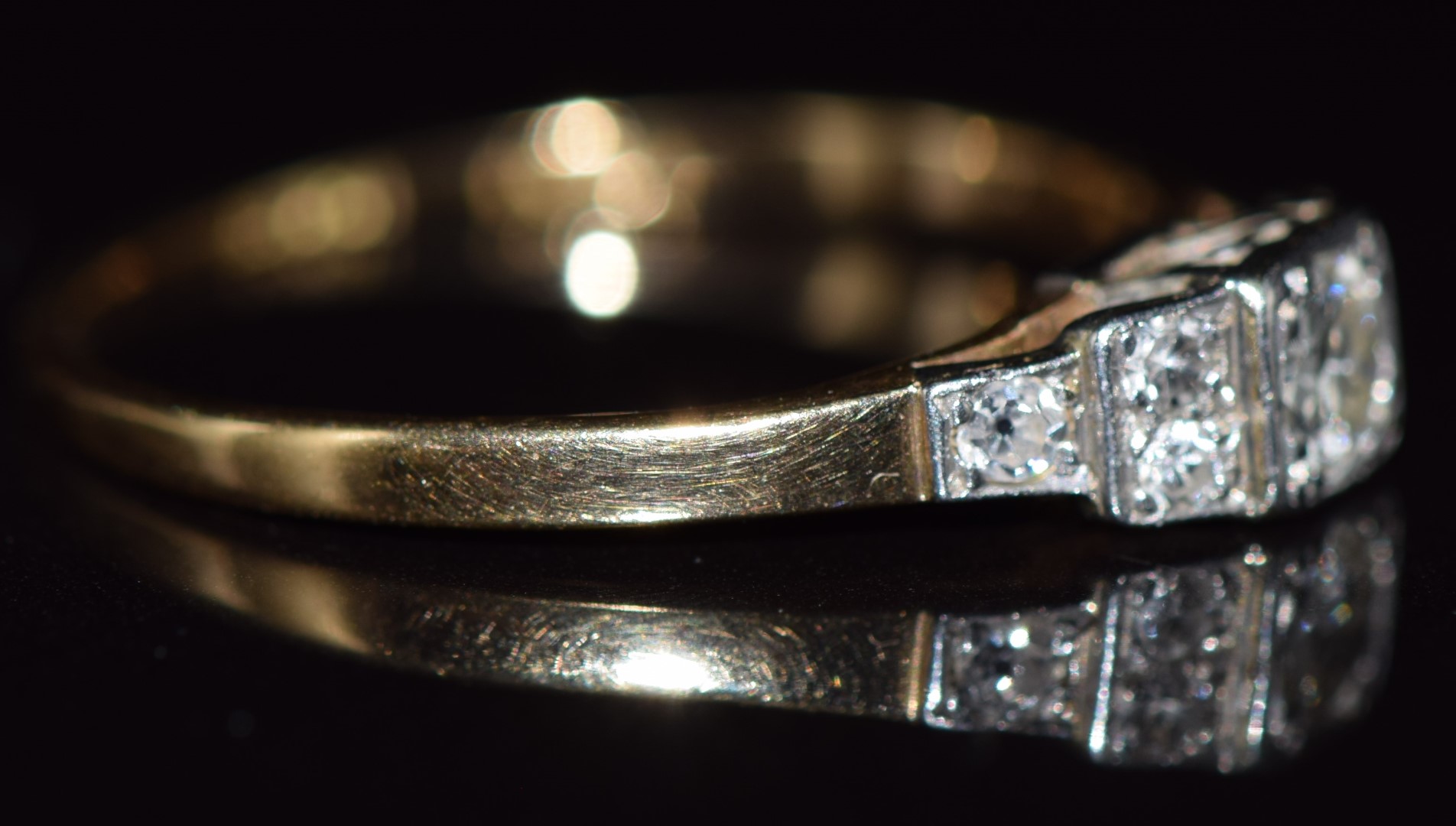 Art Deco 18ct gold ring set with seven diamonds in a tiered platinum setting, the largest diamond - Image 2 of 4