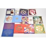 A collection of Royal Mint brilliant uncirculated coin sets, 1980s, 1990 and 2000 examples