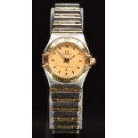 Omega Constellation ladies wristwatch with luminous hands, gold dial, back Roman numerals to the