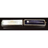 A c1900 9ct gold stick pin set with paste (2.1g), in antique box