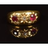A c1910 18ct gold ring set with a rose cut diamond, paste and garnet in star settings, in original