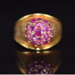 An 18ct gold ring set with a cluster of Burmese rubies, maker RHB, import mark for Birmingham