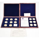 Windsor Mint two sets of gold plated commemorative coins for Royal Celebrations, in deluxe fitted