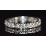 An 18ct gold eternity ring set with diamonds, 3.2g, size L