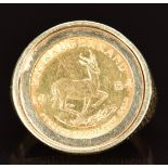 A 9ct gold ring set with a 1984 gold 1/10 Krugerrand, 7.1g, size L