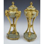 Pair of gilt metal or ormolu mounted green marble urns, with goat head and hoof supports, height
