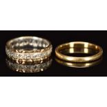 An 18ct gold ring (2.5g, size P) and a 9ct gold eternity ring set with spinel (2.9g, size N)