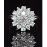 An 18ct white gold ring set with diamonds in a cluster, each diamond approximately 0.06ct, 5.8g,